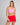 Woman wearing pink bather top and red bather shorts 