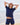 Woman wearing navy short sleeve rashguard and navy bather shorts on the beach