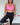 Woman in pink bather top and black leggings